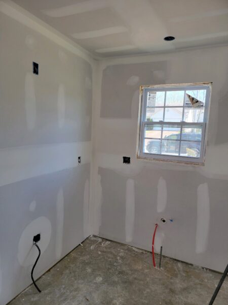 image of drywall in home with electrical wires and window