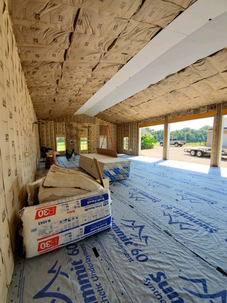 interior of garage under construction with insulation installed