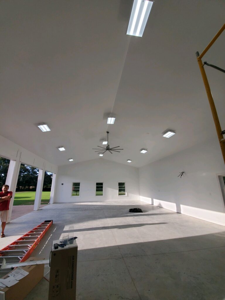 interior shot of garage area under construction with white roof and walls