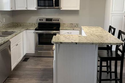 Affordable Construction remodels a kitchen with new countertop and island