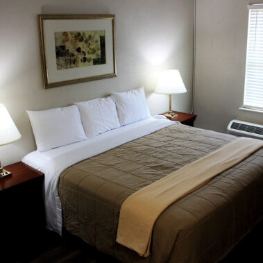 Hotel room with king size bed and window